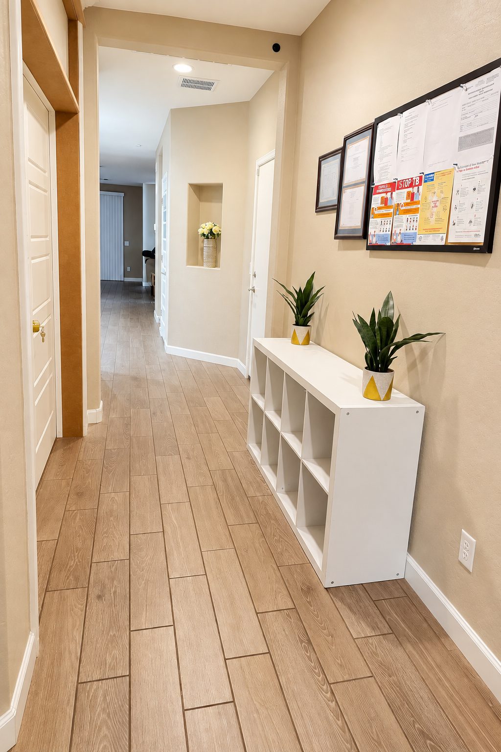 Bright hallway inside Agape Home, with wood-look flooring leading toward the living area